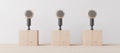 The background is an empty wood standing table with a blank podium or lectern with a microphone. Royalty Free Stock Photo