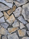 Stone wall cladding in the style of crazy paving. Royalty Free Stock Photo