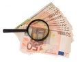 Magnifier on euro cash. Euro banknotes. Royalty Free Stock Photo