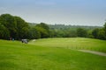 Background of evening golf course has sunlight shining down at golf course in Thailand Royalty Free Stock Photo