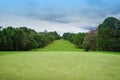 Background of evening golf course has sunlight shining down at golf course in Thailand. Nice scenery on a golf course at a late Royalty Free Stock Photo