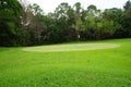 Background of evening golf course has sunlight shining down at golf course in Thailand. Nice scenery on a golf course at a late Royalty Free Stock Photo