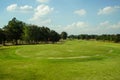 Background of evening golf course has sunlight shining down at golf course in Thailand. Nice scenery on a golf course at a late Royalty Free Stock Photo