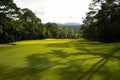 Background of evening golf course has sunlight shining down at golf course in Thailand Royalty Free Stock Photo