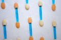 Background of eye shadow applicators. On a white background, applicators of eyeshadows are arranged in a sevenfold order Royalty Free Stock Photo