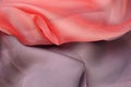 Background. The fabric of delicate pink and gray colors lies with curves and shadows. Divided into two halves. Royalty Free Stock Photo