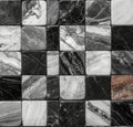 The background features a marble chess board with a checkered pattern of black and white tiles Royalty Free Stock Photo