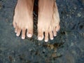 background of feet soaking in river water