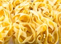 Background in fettuccine nest pasta