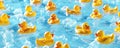 A background filled with numerous yellow rubber ducks floating on a light blue water surface, Royalty Free Stock Photo