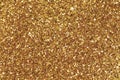 Background filled with shiny gold glitter. Royalty Free Stock Photo