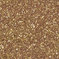 Background filled with shiny gold glitter. Low contrast photo. Seamless square texture. Tile ready. Royalty Free Stock Photo