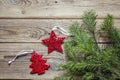 Background with fir branches and red Christmas decorations on old wooden boards. Space for text. Royalty Free Stock Photo