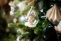 Background of fir tree with toy little angel white christmas decoration Royalty Free Stock Photo