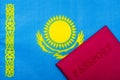 On the background of the flag of Kazakhstan is a passport