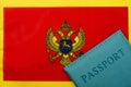 On the background of the flag of Montenegro is a passport Royalty Free Stock Photo