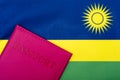 On the background of the flag of Rwanda is a passport