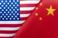 Background of the flags of the USA and China. The concept of interaction or counteraction between two countries