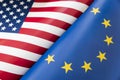 Background of the flags of the USA and European Union. The concept of interaction or counteraction between two countries. Royalty Free Stock Photo