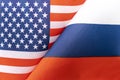 Background of the flags of the USA and russia. The concept of interaction or counteraction between two countries. International
