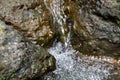 Background flowing water falling between the rocks in the river Royalty Free Stock Photo