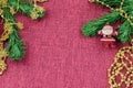 Background in the form of a Christmas tree decoration - Santa Claus under an artificial spruce branch and golden beads Royalty Free Stock Photo