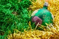 Background in the form of Christmas tree decorations - a large green painted ball, golden and green rain