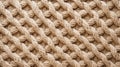 Background in the form of part of the texture of beige knitted fabric. Royalty Free Stock Photo
