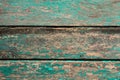Background in the form of three old boards with green paint peeling off Royalty Free Stock Photo