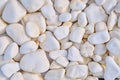 Background in the form of white rock. Roundish stone texture. Texture of white stones, close-up