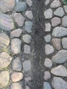 Background. fragment. texture. the old road is paved with wild stone, cobblestones. landscape design, natural style.