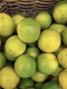 Background of fresh green limes closeup, fruits on sale, mobile photo Royalty Free Stock Photo