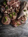 background of fresh raw meat. Different types of raw pork meat, chicken, beef, turkey giblets with herbs on dark marble, copy Royalty Free Stock Photo