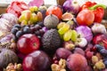 Background of fresh vegetables and fruits. Purple eggplant, plums, figs, apples, avocado, grape, hazelnut, sweet pepper, tomato an Royalty Free Stock Photo