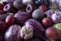 Background of fresh vegetables and fruits. Purple eggplant, plums, figs, apples, grape and garlic. Top view.