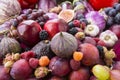 Background of fresh vegetables and fruits. Purple eggplant, plums, figs, apples, raspberries, avocado, grape, hazelnut, sweet pepp