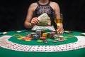 Background of a gaming casino, poker table, cards, chips and a girl with a glass of wine in the background. Background for a