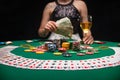 Background of a gaming casino, poker table, cards, chips and a girl with a glass of wine in the background. Background for a Royalty Free Stock Photo