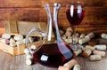 Background with glass of wine, decanter and corks Royalty Free Stock Photo