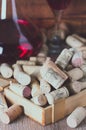 Background with glass of wine, decanter and wine corks. Royalty Free Stock Photo