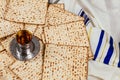 Background with glass of wine and matzo passover celebration