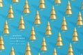 Background with golden christmas trees on blue background. New Year cone shaped tree. Minimal design christmas card