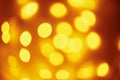 Background of golden lights in a bokeh. Defocused abstract blurred lights Royalty Free Stock Photo