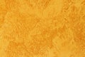 Background of golden textured surface. Golden texture for design and web background. Shiny golden surface of concrete wall Royalty Free Stock Photo