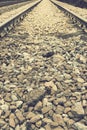 Background with gravel and railroad line. Old railroad. toned. vertical photo