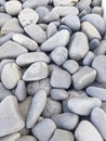 Background of gray sea stones of different shapes and tones. Small Naturally Polished Rocks, Pebbles background and pattern Royalty Free Stock Photo