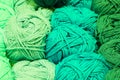 background of green balls of wool thread on sale in yarn and knitwear shop Royalty Free Stock Photo