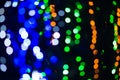 Background of green, blue and orange glitter lights. Defocused Royalty Free Stock Photo