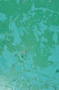 Background of green and blue textured shabby wall with stains of paint and rust. Peeling paint. Royalty Free Stock Photo