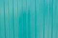 Background of green metal siding, corrugated iron sheet for exterior decoration during construction Royalty Free Stock Photo